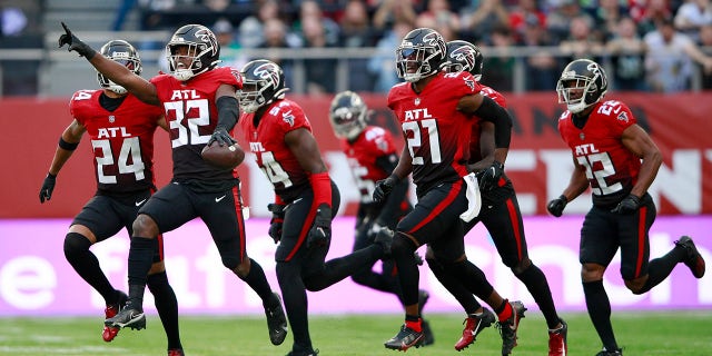 Atlanta Falcons safety Jaylinn Hawkins (32) celebrates an interception during the first half of an NFL football game between the New York Jets and the Atlanta Falcons at Tottenham Hotspur Stadium, London, in England on Sunday October 10, 2021.