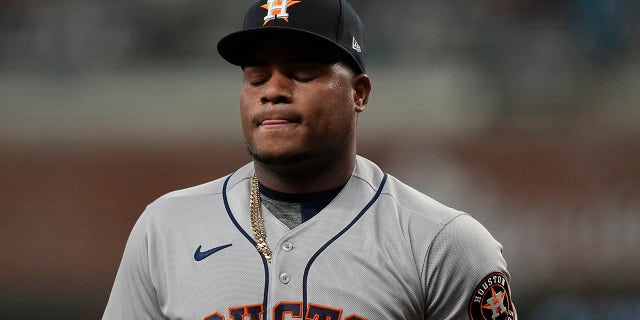 Houston Astros starting pitcher Framber Valdez reacts after the Atlanta Braves' Adam Duvall hit a grand slam during the first inning of Game 5 of the World Series Sunday, Oct. 31, 2021, in Atlanta.