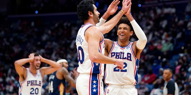 Philadelphia 76ers guard Furkan Korkmaz celebrates his 3-pointer with guard Matisse Thybulle (22) and forward Georges Niang (20) in the second half of an NBA basketball game in New Orleans, Wednesday, Oct. 20, 2021. The 76ers won 117-97.