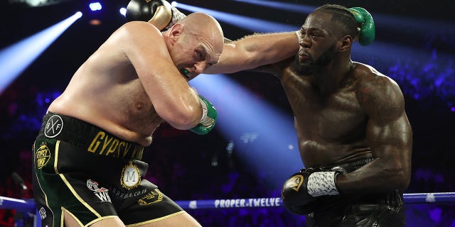 Deontay Wilder punches Tyson Fury during their heavyweight bout for Wilder's WBC and Fury's lineal heavyweight title Feb. 22, 2020 at MGM Grand Garden Arena in Las Vegas, Nev.