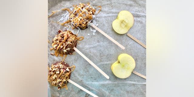 The honey crisp apple slices should look similar to cake pops when you're done.