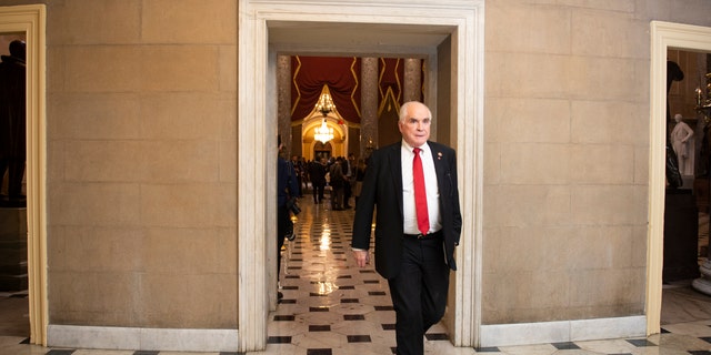 UNITED STATES - DECEMBER 18: Rep. Mike Kelly, R-Pa., walks through the hallway outside of Statuary Hall. (Photo by Caroline Brehman/CQ-Roll Call, Inc via Getty Images)