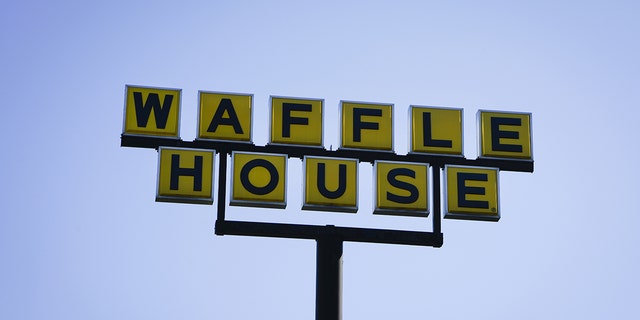 Signage stands outside a Waffle House Inc. restaurant in Brookhaven, Georgia, April 27, 2020. 