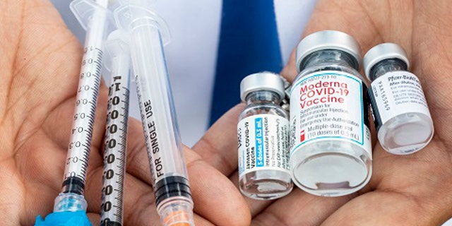 Los Angeles, CA - May 13: Bottles of the three current COVID-19 vaccines from Johnson & Johnson, Moderna and Pfizer, with hypodermics needles, photographed at the COVID-19 vaccination site at Kedren Community Health Center, in Los Angeles, CA, Thursday, May 13, 2021.
