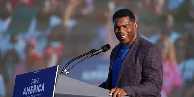 Republican Senate candidate and former college and pro football star Herschel Walker speaks at a rally featuring former President Donald Trump on Sept. 25, 2021, in Perry, Georgia.