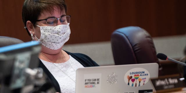 Loudoun County school board member Brenda Sheridan looks at her laptop during a public school board meeting in Ashburn, Virginia, on Oct. 12, 2021. (Photo by ANDREW CABALLERO-REYNOLDS/AFP via Getty Images)