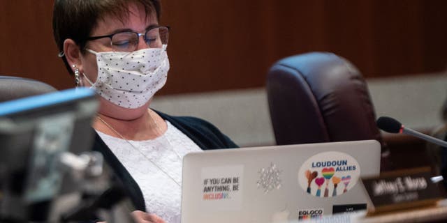 Loudoun County school board member Brenda Sheridan looks at her laptop during a public school board meeting in Ashburn, Virginia, on Oct. 12, 2021. (Photo by ANDREW CABALLERO-REYNOLDS/AFP via Getty Images)