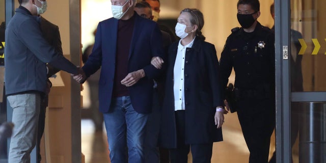 ORANGE CA OCTOBER 17, 2021 - Former President Bill Clinton, standing with his wife, Hillary, was discharged from UC Irvine Medical Center Sunday morning. (Allen J. Schaben / Los Angeles Times via Getty Images)
