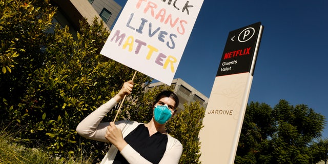 HOLLYWOOD CA OCTOBER 20, 2021 - Lily Weaver was outside Netflix's office in Hollywood Wednesday morning in support of a walkout to protest Netflix's decision to release Dave Chappelle's latest Netflix special, which contains a litany of transphobic material. Weaver is not employed by Netflix. (Al Seib / Los Angeles Times via Getty Images)