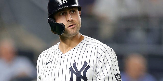 Joey Gallo #13 of the New York Yankees reacts after striking out during the third inning against the Texas Rangers at Yankee Stadium on September 21, 2021 in the Bronx borough of New York City.