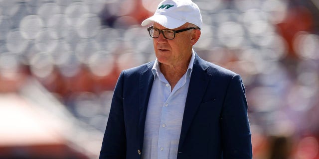 New York Jets owner Woody Johnson on the field before the game against Denver Broncos at Empower Field At Mile High on Sept. 26, 2021 in Denver, Colorado.