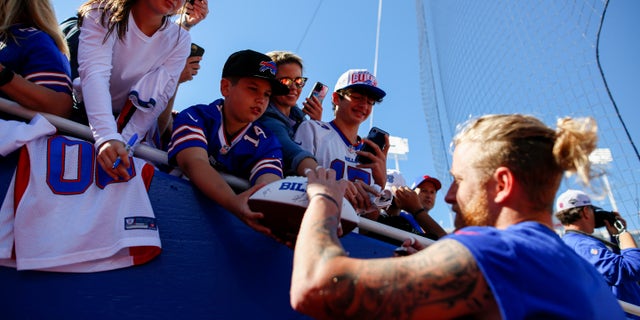 Cole Beasley #11 of the Buffalo Bills signs autographs before the game against the Washington Football Team at Highmark Stadium on Sept. 26, 2021 in Orchard Park, New York.