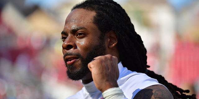 TAMPA, FLORIDA - OCTOBER 10: Richard Sherman #5 of the Tampa Bay Buccaneers reacts after defeating the Miami Dolphins 45-17 at Raymond James Stadium on October 10, 2021 in Tampa, Florida. (Photo by Julio Aguilar/Getty Images)
