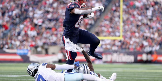 Jonnu Smith (81) of the New England Patriots runs with the ball against Trevon Diggs (7) of the Dallas Cowboys in the first quarter at Gillette Stadium Oct. 17, 2021 in Foxborough, Mass.