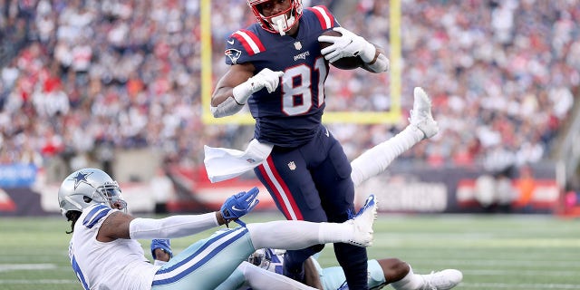 Jonnu Smith (81) of the New England Patriots runs with the ball against Trevon Diggs (7) of the Dallas Cowboys in the first quarter at Gillette Stadium Oct. 17, 2021 in Foxborough, Mass.