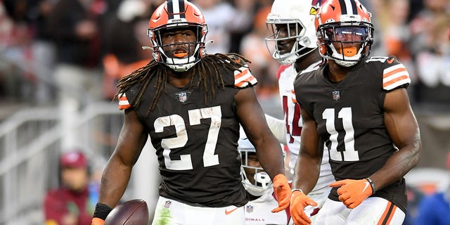 Kareem Hunt #27 of the Cleveland Browns reacts after a play with teammate Donovan Peoples-Jones #11 during the fourth quarter against the Arizona Cardinals at FirstEnergy Stadium on October 17, 2021 in Cleveland, Ohio.
