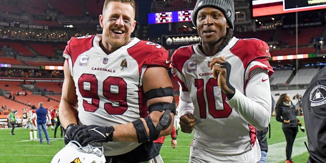 CLEVELAND, OH - OCTOBER 17: J.J. Watt #99 and DeAndre Hopkins #10 of the Arizona Cardinals react after a 37-14 win against the Cleveland Browns at FirstEnergy Stadium on October 17, 2021 in Cleveland, Ohio.