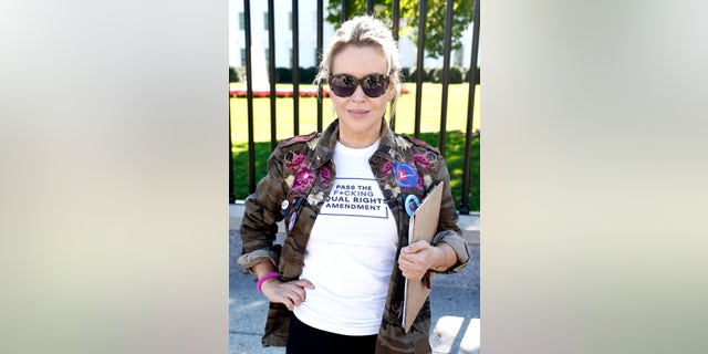 American Way board member Milano attends the ‘No More Excuses: Voting Rights Now’ rally held in front of The White House on October 19, 2021 in Washington, DC.