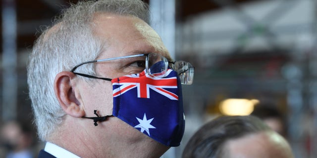 SYDNEY, AUSTRALIA - OCTOBER 22: Prime Minister of Australia, Scott Morrison speaks to Qantas employees at the Qantas Jetbase on October 22, 2021 in Sydney, Australia. (Photo by James D. Morgan/Getty Images)