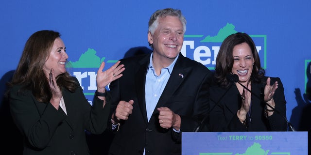 DUMFRIES, VIRGINIA - OCTOBER 21: Former Virginia Gov. Terry McAuliffe (C) dances after U.S. Vice President Kamala Harris (R) spoke  at his campaign event  on October 21, 2021 in Dumfries, Virginia. The Virginia gubernatorial election, pitting McAuliffe against Republican candidate Glenn Youngkin, is November 2. Also pictured is McAuliffe's wife, Dorothy (L). (Photo by Win McNamee/Getty Images)