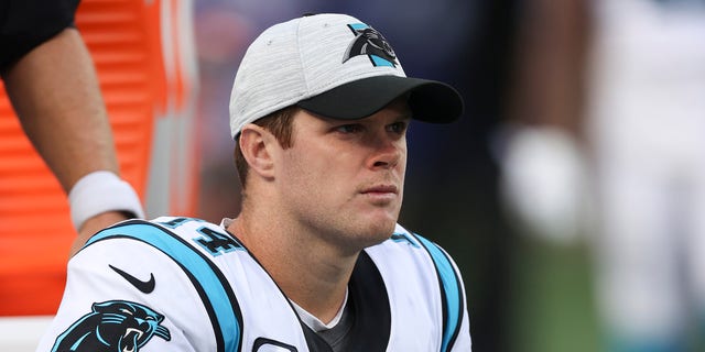 No. 14 Sam Darnold of the Carolina Panthers reacts on the bench during the second half of a game against the New York Giants at MetLife Stadium on October 24, 2021 in East Rutherford, New Jersey.