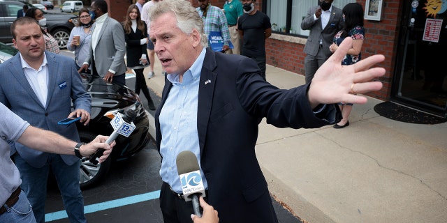 VIRGINIA BEACH, VIRGINIA - OCTOBER 25: Democratic gubernatorial candidate, former Virginia Gov. Terry McAuliffe answers questions from reporters after speaking during a campaign event where he received the endorsement of the Virginia Beach African American Political Action Council at The Happy Cafe on October 25, 2021 in Virginia Beach, Virginia. The Virginia gubernatorial election, pitting McAuliffe against Republican candidate Glenn Youngkin, is November 2. (Photo by Win McNamee/Getty Images)