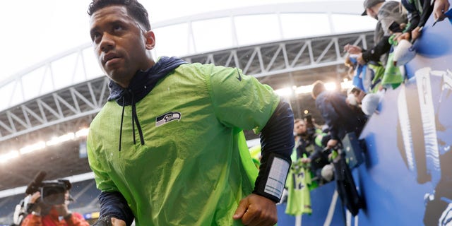 Russell Wilson of the Seattle Seahawks participates in warmups prior to a game against the New Orleans Saints at Lumen Field Oct. 25, 2021, in Seattle.