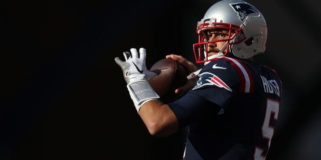 Brian Hoyer of the New England Patriots warms up during the game against the New York Jets at Gillette Stadium on Oct. 24, 2021, in Foxborough, Massachusetts.