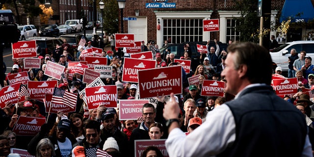 ALEXANDRIA, VIRGINIA - OCTOBER 30: Supporters listen as Virginia Republican gubernatorial candidate Glenn Youngkin, October 30, 2021 in Alexandria, Virginia. 