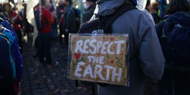 GLASGOW, SCOTLAND - OCTOBER 30: Pilgrimage groups who have walked to Glasgow are joined by members of the group, Extinction Rebellion as they walk to raise awareness of the climate crisis on October 30, 2021 in Glasgow, Scotland. 