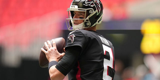 Matt Ryan warms up before the Falcons' game against the Carolina Panthers at Mercedes-Benz Stadium on Oct. 31, 2021, in Atlanta, Georgia.