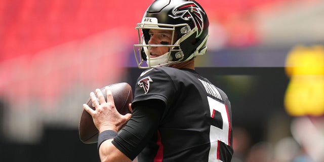 Matt Ryan warms up before the Falcons' game against the Carolina Panthers at Mercedes-Benz Stadium on Oct. 31, 2021, in Atlanta, Georgia.