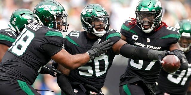 Shaq Lawson (50) of the New York Jets celebrates after making an interception during the fourth quarter against the Cincinnati Bengals at MetLife Stadium Oct. 31, 2021 in East Rutherford, N.J.