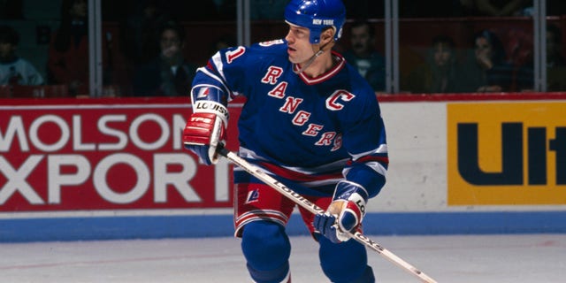 MONTREAL, CANADA - CIRCA 1990: Mark Messier #11 of the New York Rangers skates Circa 1990 at the Montreal Forum in Montreal, Quebec, Canada.