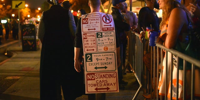 WEST HOLLYWOOD, CA - OCTOBER 31: A participant dressed as Los Angeles parking signs at the West Hollywood Halloween Carnaval on October 31, 2017 in West Hollywood, California. (Photo by Chelsea Guglielmino/Getty Images)
