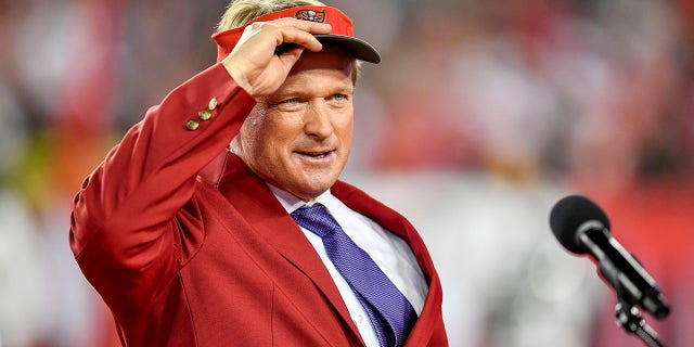John Gruden puts on his Bucs hat prior to his "Ring of Honor" speech during an NFL game between the Atlanta Falcons and the Tampa Bay Buccaneers on Dec. 18, 2017, at Raymond James Stadium in Tampa, FL. The Falcons defeated the Bucs 24-21.