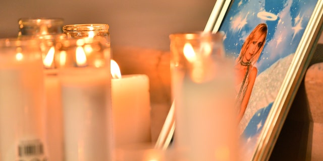 Candles are placed in front of a photo of cinematographer Halyna Hutchins during a vigil in her honor at Albuquerque Civic Plaza on October 23, 2021 in Albuquerque, New Mexico. Hutchins was killed on set while filming the movie ‘Rust’ at Bonanza Creek Ranch near Santa Fe, New Mexico on October 21, 2021. The film's star and producer Alec Baldwin discharged a prop firearm that hit Hutchins and director Joel Souza.