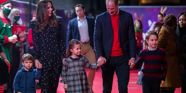 Prince William, Duke of Cambridge and Catherine, Duchess of Cambridge with their children, Prince Louis, Princess Charlotte and Prince George, attend a special pantomime performance at London's Palladium Theatre, hosted by The National Lottery, to thank key workers and their families for their efforts throughout the pandemic on December 11, 2020 in London, England.