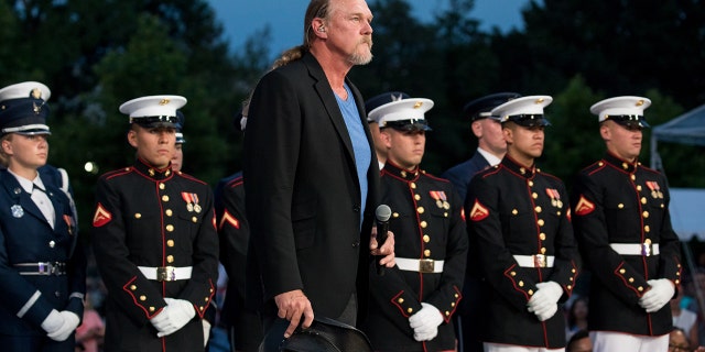 Trace Adkins, surrounded by members of the U.S. Army, on Monday, July 3, 2017, is rehearsing for the 37th annual A Capitol Fourth, an Independence Day celebration, on the west lawn of the U.S. Capitol.
