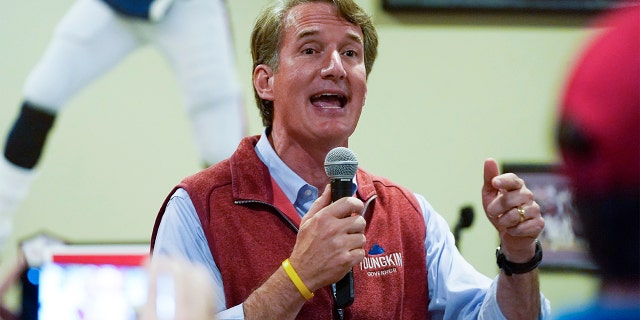 In this Oct. 11, 2021, file photo Virginia Republican gubernatorial candidate Glenn Youngkin talks to supporters during a meet and greet at a sports bar in Chesapeake, Virginia.