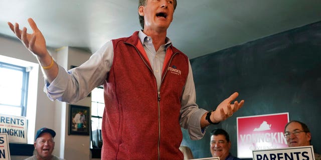 Virginia Republican gubernatorial candidate Glenn Youngkin gestures as he talks with supporters during a rally in Culpeper, Oct. 13, 2021. Youngkin faces former Gov. Terry McAuliffe in the November election. 