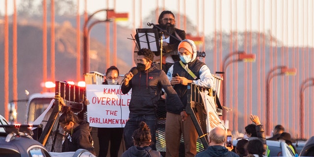 SAN FRANCISCO, CA - SEPTEMBER 30: Protesters block northbound traffic on the Golden Gate Bridge in San Francisco, CA. Thursday, September 30, 2021 during a demonstration demanding Congress grant a pathway to citizenship for the country's 11 million undocumented people. (Jessica Christian/The San Francisco Chronicle via Getty Images)