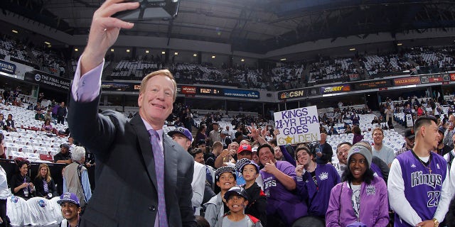 SACRAMENTO, CA - APRIL 9: Sacramento Kings broadcaster Grant Napear takes a selfie with fans prior to the game against the Oklahoma City Thunder on April 9, 2016 at Sleep Train Arena in Sacramento, California.