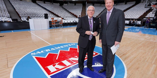 SACRAMENTO, CA - APRIL 9: American sportscaster Gary Gerould and Sacramento Kings broadcaster Grant Napear pose for a photo in front othe Sacramento Kings logo prior to the game against the Oklahoma City Thunder on April 9, 2016 at Sleep Train Arena in Sacramento, California.