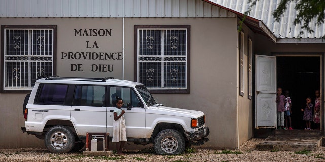 Children stand in the courtyard of the Maison La Providence de Dieu orphanage it Ganthier, Croix-des-Bouquets, Haiti, on Sunday where a gang abducted 17 missionaries from a U.S.-based organization.