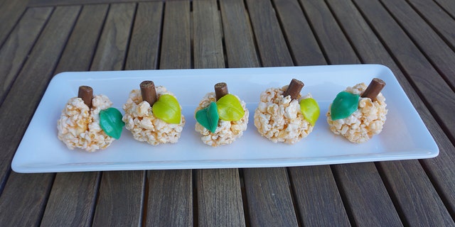 For Halloween, jazz popcorn time up a bit and make these popcorn balls from Sarah Mason of food blog Fluent Foodie. (Sarah Mason / Fluent Foodie)