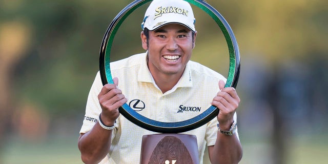 Hideki Matsuyama of Japan poses with the trophy after winning the final round of the Zozo Championship golf tournament at Accordia Golf Narashino Country Club on Sunday, Oct. 24, 2021 in Inzai, Chiba Prefecture, Japan.