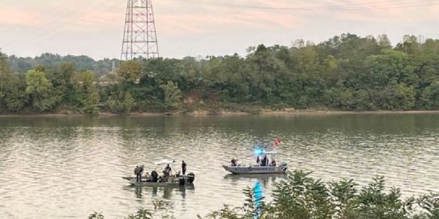 Authorities search the Ohio River for an SUV connected to a 2002 missing persons case in Ohio.