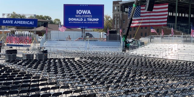 Workers at the site of former President Trump's rally in Iowa put the finishing touches to the Iowa Fairground site on the eve of the event, October 8, 2021 in Des Moines, Iowa