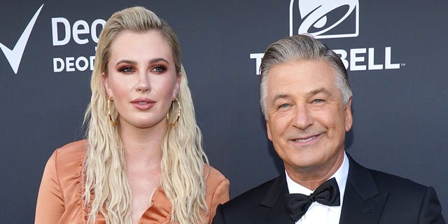Ireland Baldwin showed off her baby bump as her father Alec prepares to go to court over the fatal "Rust" shooting.